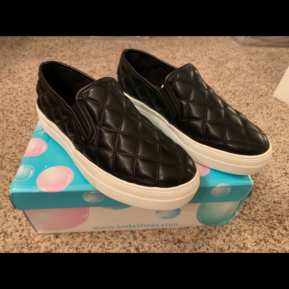 Black slip on shoes.